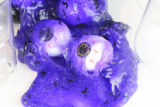 DIY neon purple witches’ brew slime with bats and eyeballs