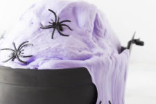 DIY lavender fluffy witches’ brew slime with spiders