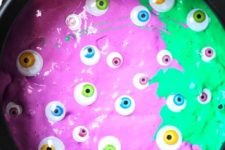 DIY emerald and purple witches’ brew slime with eyeballs