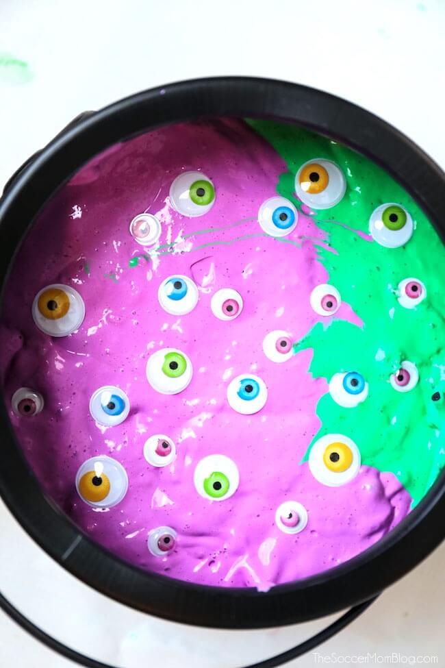DIY emerald and purple witches' brew slime with eyeballs