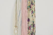 DIY scarf hanger using a pant hanger and shower curtain hooks
