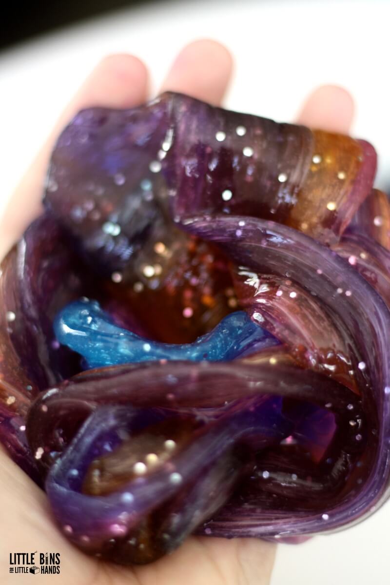 DIY colorful and dark galaxy slime with stars (via littlebinsforlittlehands.com)