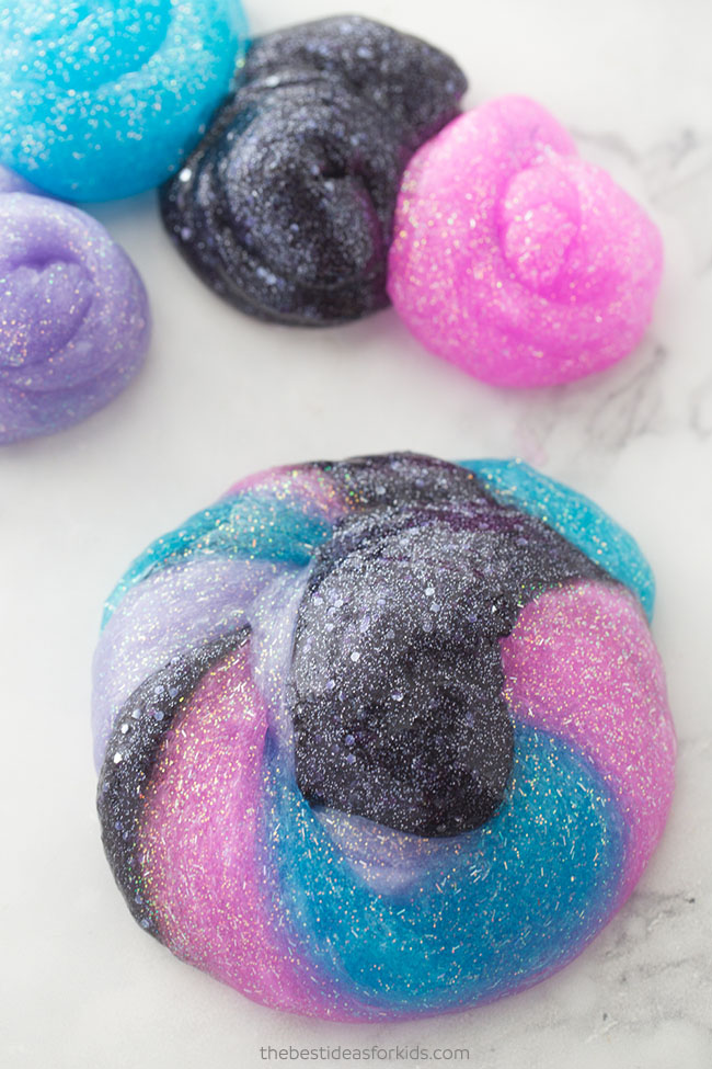DIY bright and colorful galaxy slime with glitter (via www.thebestideasforkids.com)