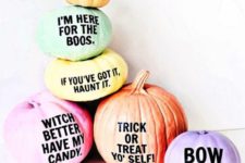 03 an arrangement of super colorful Halloween pumpkins with funny and whimsy phrases on them for a modern touch