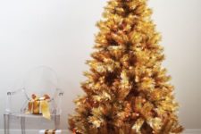 07 a gold pre-lit Christmas tree doesn’t require any ornaments or decorations as it’s bold itself