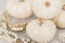 07 white natural pumpkins with copper stems and shiny pearls for detailing are amazing for glam Halloween decor