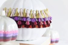 09 add a touch of gypsy to your Halloween decor making a tassel pumpkin with colorful decor