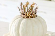 13 a white pumpkin topped with a beautiful crown is a cute and glam decoration or even a centerpiece