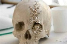 19 a glam skull wtih pearls, beads, rhinestones and sequins is a gorgeous scary decoration to make