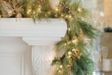 20 a cool garland of evergreens, lights, gold ornamentsand ribbons looks very glam