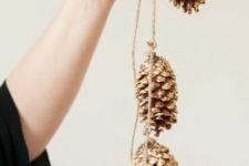 21 a gold pinecone garland is great for rustic and glam Christmas decor – make it yourself