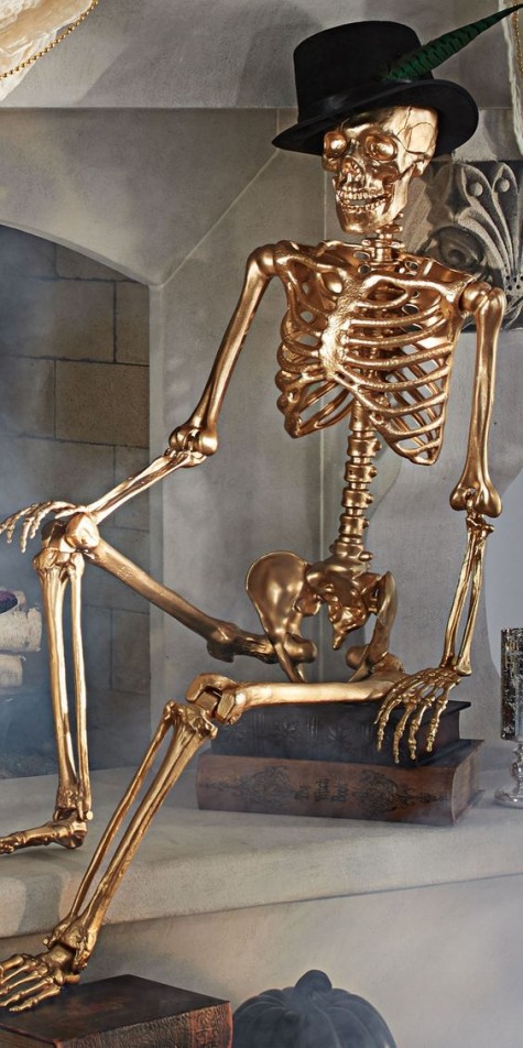 a gold skeleton in a top hat will be a nice decoration with a glam feel and can be used inside and outside