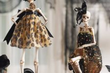 26 refined skeleton dolls in stylish black and gold dresses will be amazing decorations for Halloween