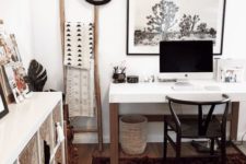 a boho Scandi home office with a boho rug, baskets, printed textiles and tassels and a sleek white desk