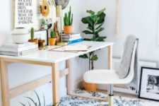 a boho meets glam home office with a boho rug, macrame and fringe, potted plants and lots of cacti