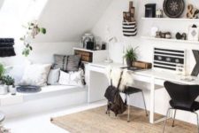 a cool shared boho home office in black and white, a jute rug, stripes, pillows and open shelving with objects on display