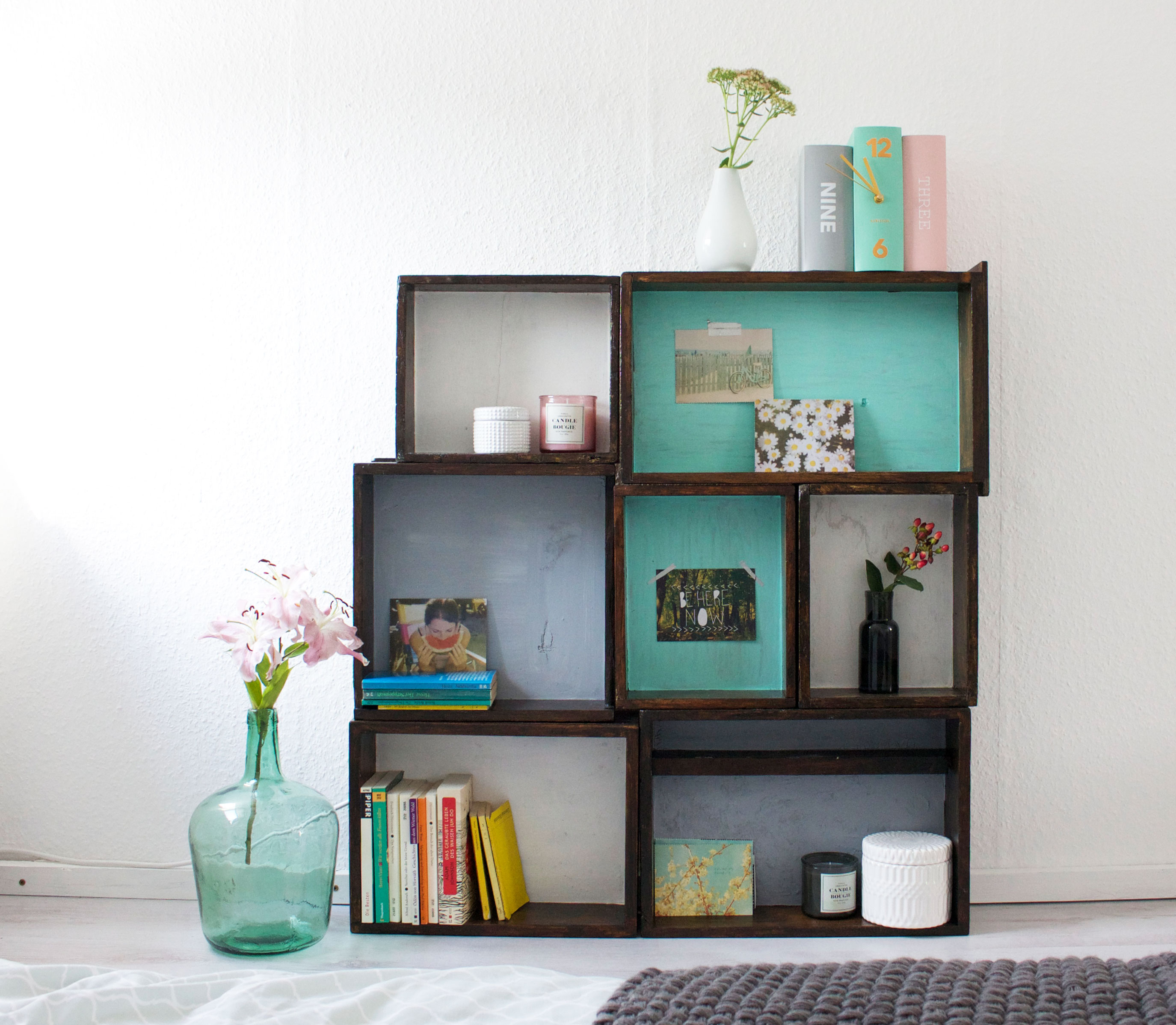 DIY wooden box shelving unit composed of several boxes