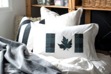 DIY stenciled buffalo check pillow with a leaf