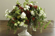 DIY lush textural holiday floral centerpiece in red, green and white