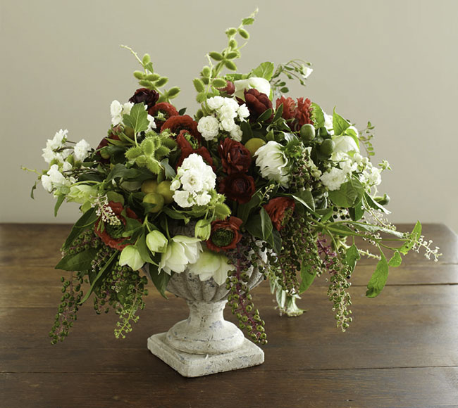 DIY lush textural holiday floral centerpiece in red, green and white (via greenweddingshoes.com)