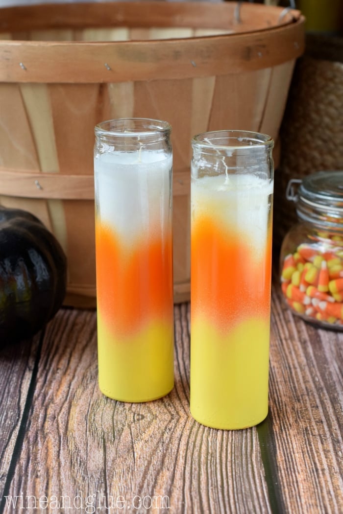 DIY easy candy corn candles for Halloween (via www.wineandglue.com)