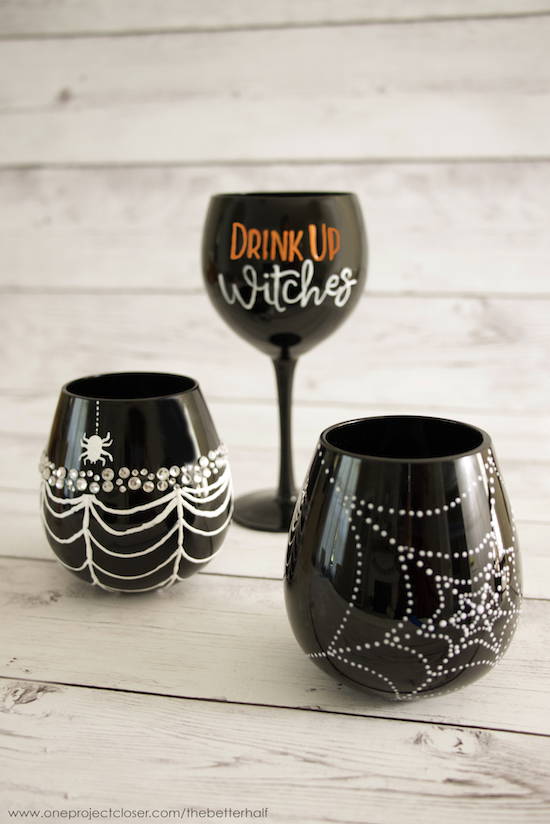 DIY glam black Halloween glasses decorated with rhinestones and white paint (via www.oneprojectcloser.com)