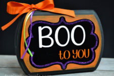 DIY colorful Halloween sign with bright colors and bows