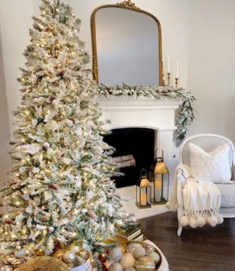 a refined flocked Christmas tree decorated with only lights and pinecones is all you need for a winter wonderland in your home