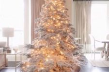 03 a large flocked Christmas tree with lights – you don’t need any ornaments for a gorgeous and fairy-tale look