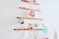 05 a wall-mounted copper pipe Christmas tree with colorful ornaments is a creative alternative to a usual one