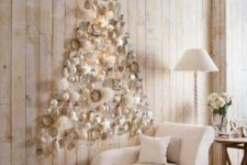 13 a creamy and mother of pearl wall-mounted Christmas tree with ornaments of various sizes and shapes