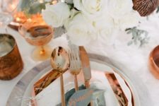 16 a geometric copper charger and cutlery look very elegant paired with white blooms and plates plus amber glasses
