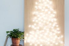 17 a string light Christmas tree is a creative and festive idea that you can easily DIY