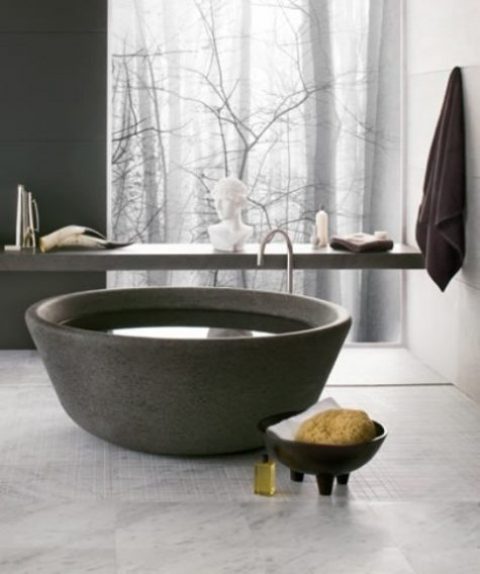 a unique bowl like stone bathtub is an ultimate solution for a contemporary or minimalist bathroom