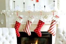 25 red and white stockings, large red snowflakes on the wall for fun and cool Christmas decor
