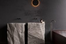 26 two free-standing sinks cut out of rough stone looks extremely spectacular and super bold