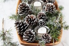a simple centerpiece with pinecones