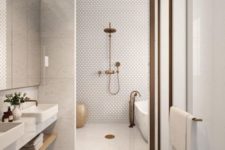a stylish minimalist bathroom with penny and oversized white tiles, aged metal touches and a mirror wall