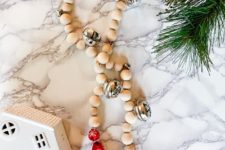 DIY wooden bead Christmas garland with bells and colorful tassels