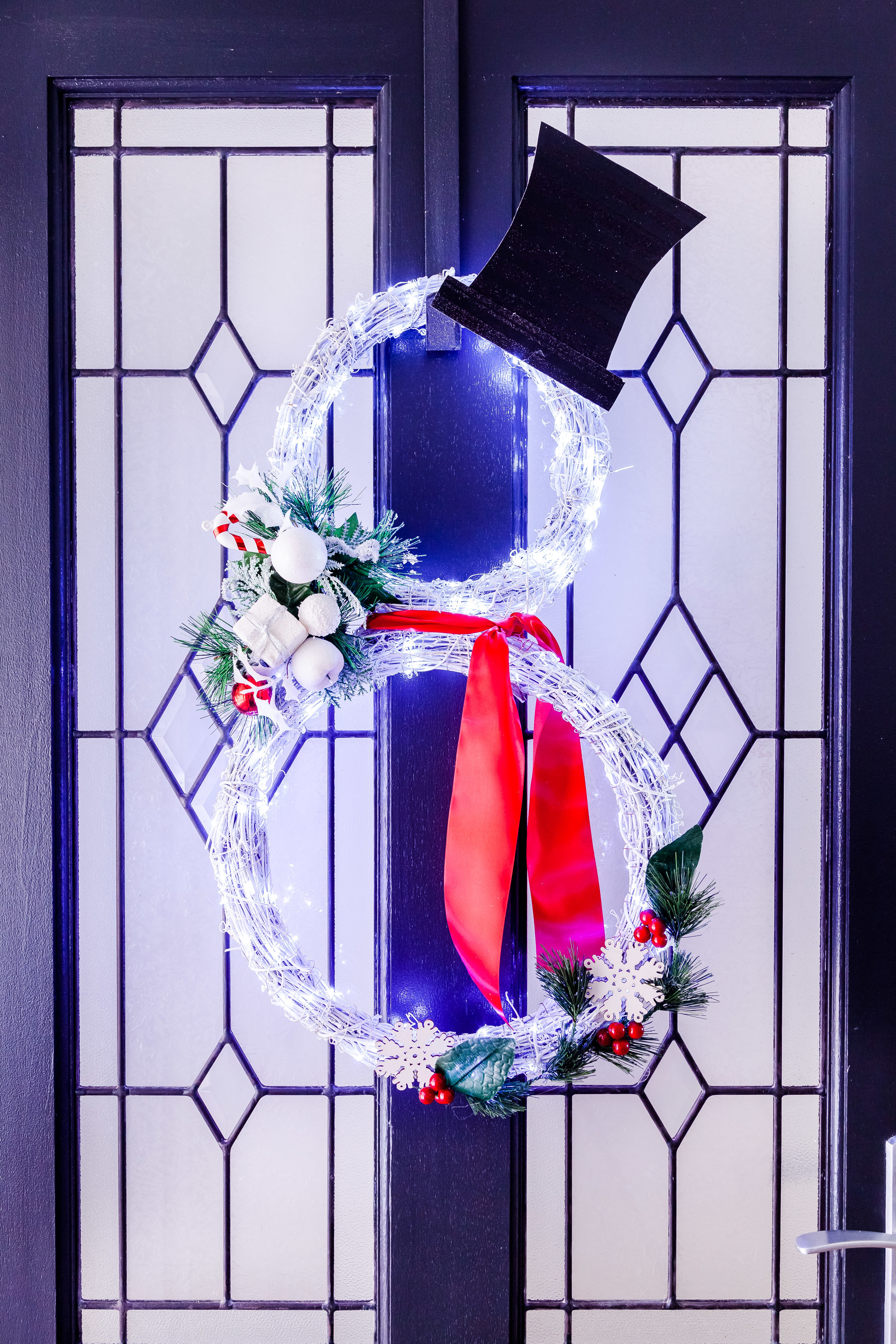 DIY lit up snowman Christmas wreath