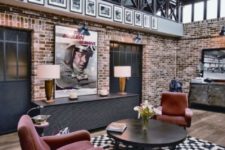 04 an industrial meets modern space with a bold black and white polka dot rug for a touch of pattern