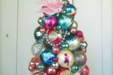 05 a vintage Christmas ornament tree on a dish with beads is a stylish and creative idea