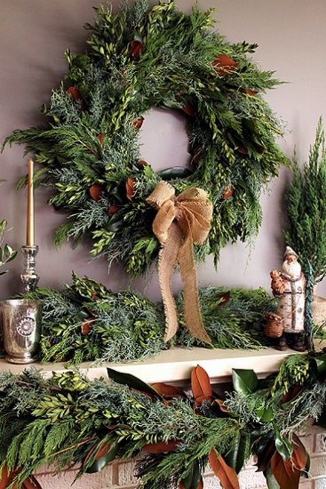 an evergreen wreath and garland with magnolia leaves and burlap will dress up your mantel and make it holiday-like