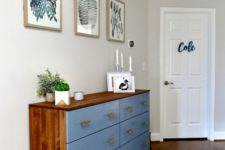 06 a bold Tarva hack with rich-colored stain and blue paint, with brass handles for a mid-century modern space