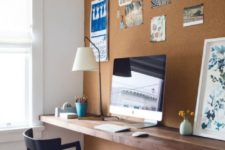 07 a cork wall for notes and a floating desk of reclaimed wood make up a comfy working nook with a modern feel