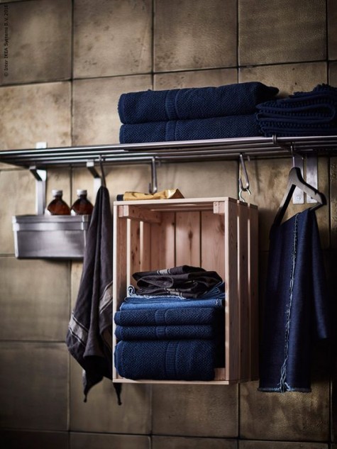 a suspended Knagglig box in the bathroom for storing towels is a genius and cool solution to go for