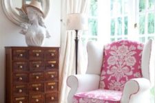 07 a vintage chair is made more modern with a pink printed seat and back and white armrests with a pink edge looks very soft and girlish