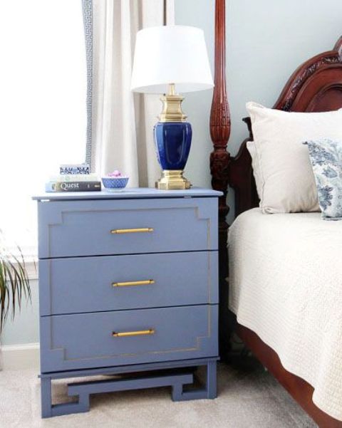 a blue Tarva hack with painted inlays, brass handles and catchy legs for a coastal bedroom
