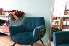 09 a rounded chair with teal upholstery and a printed curved base will catch an eye with its shapes and with its colors