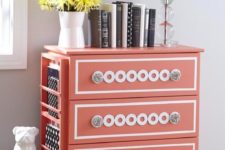 10 a coral Tarva hack with white inlays, glass knobs and a side magazine or book holder that makes it even more functional